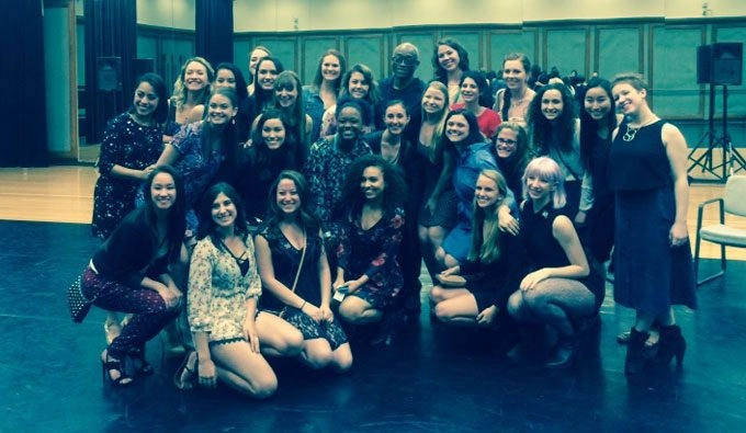 The Loyola Marymount University dance company posing in a studio with Bill T Jones.